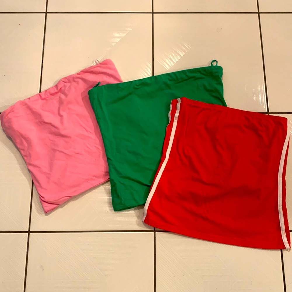 3 strapless tube tops (bandeau tops): 1 pink; 1 green; 1 red with white stripes.